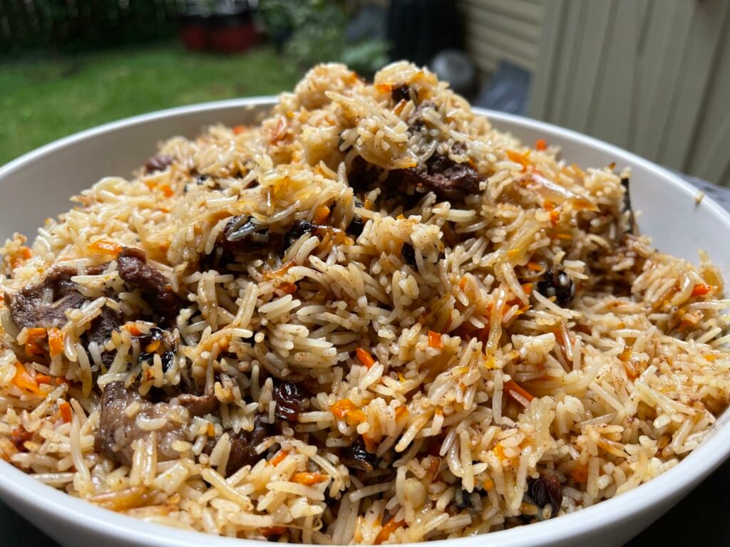 Afghan Food - Qabeli Palow (Slow-Cooked Rice with Spices, Raisins, And Carrots)