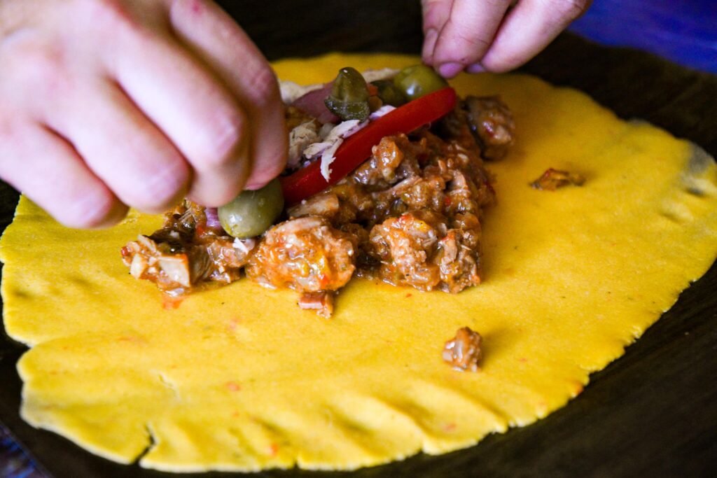 Venezuela Food - Perico (a corn dough stuffed with meat, raisins, olives, and capers)