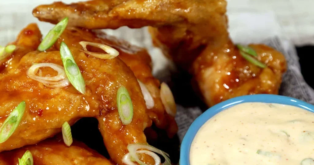 Thai Food - Sriracha butter wings with ranch sauce